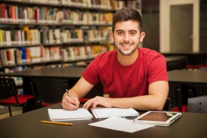 Happy student doing homework